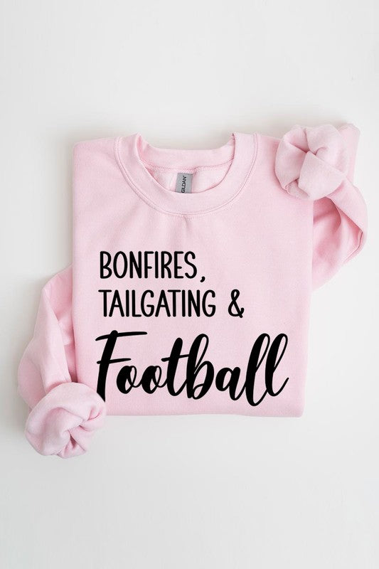 Game day vibes: Bonfires and football graphic sweatshirts