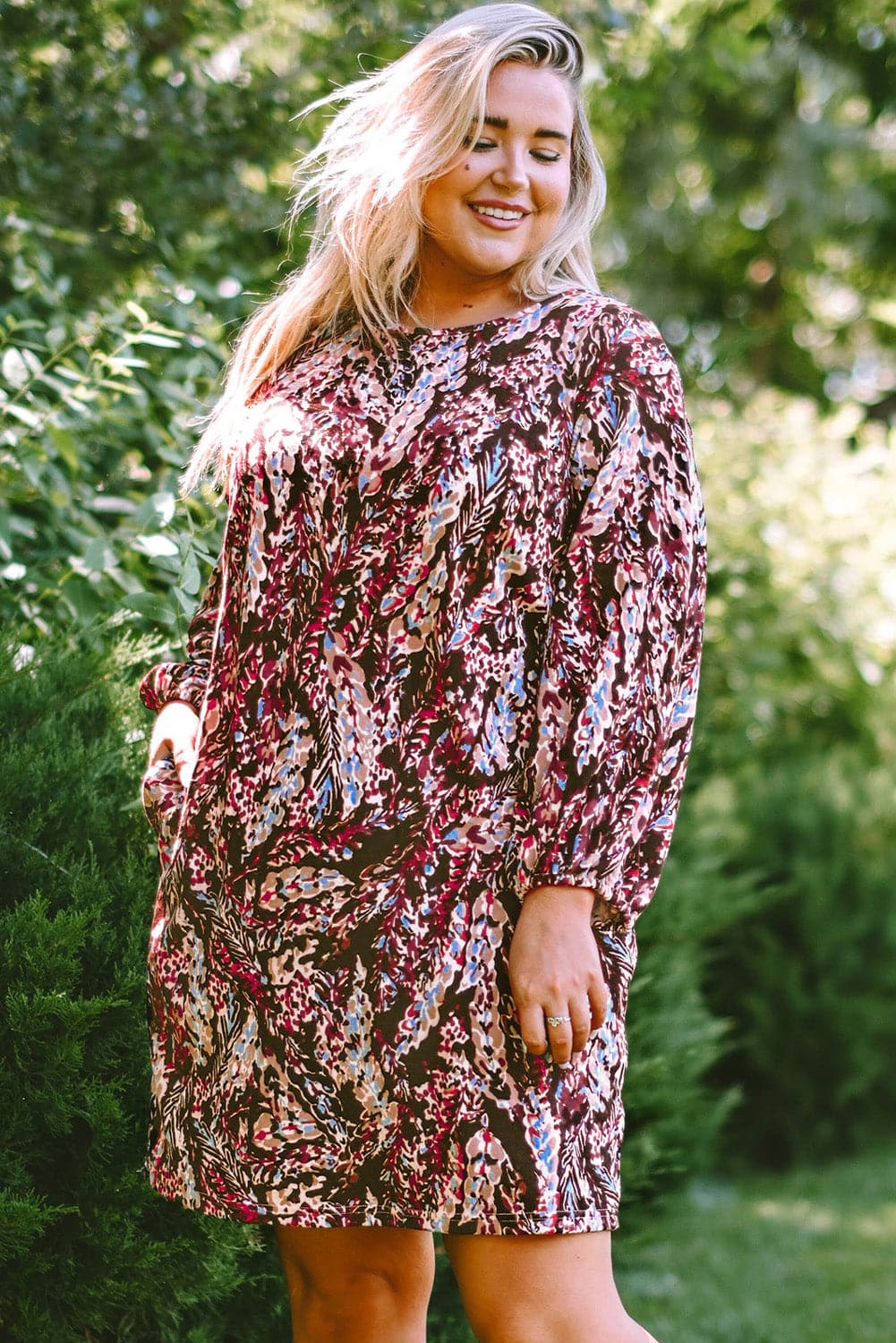 Plus Size Printed Round Neck Long Sleeve Mini Dress.