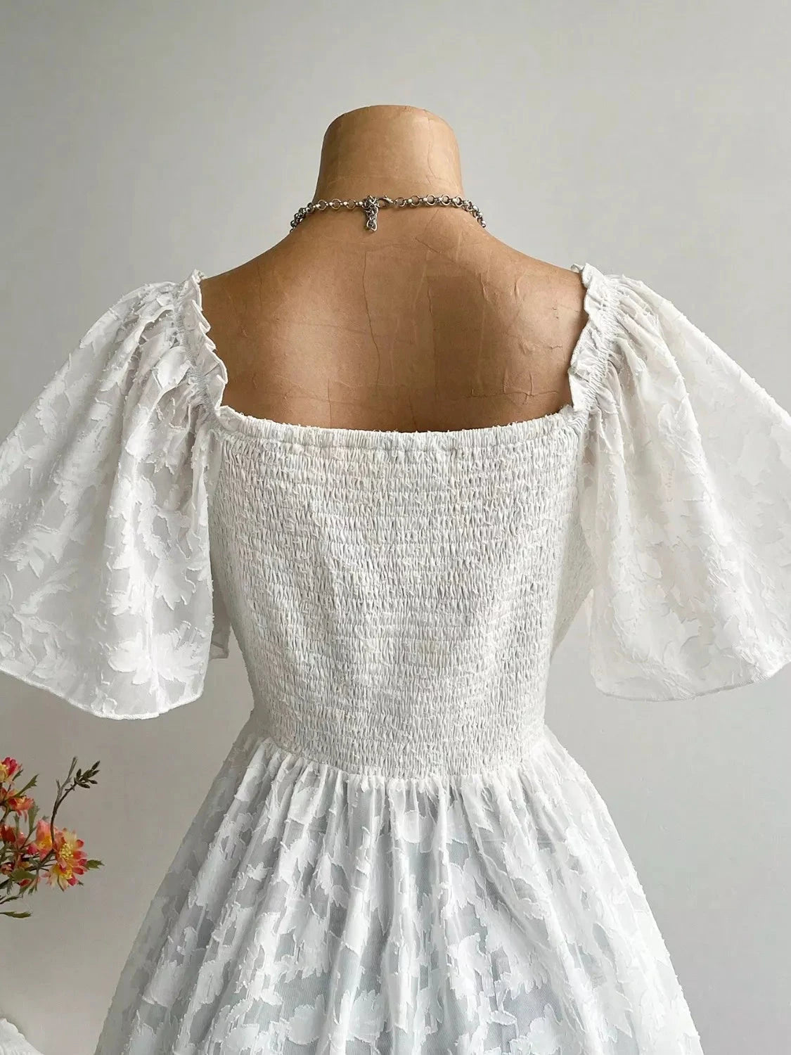 Plus Size Floral Flutter Sleeve Blouse with Smocked Back Coco’s Tee Boutique