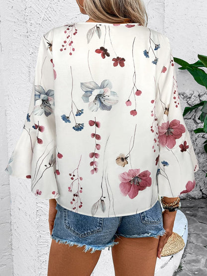 Ruffled Printed V-Neck Half Sleeve Blouse.