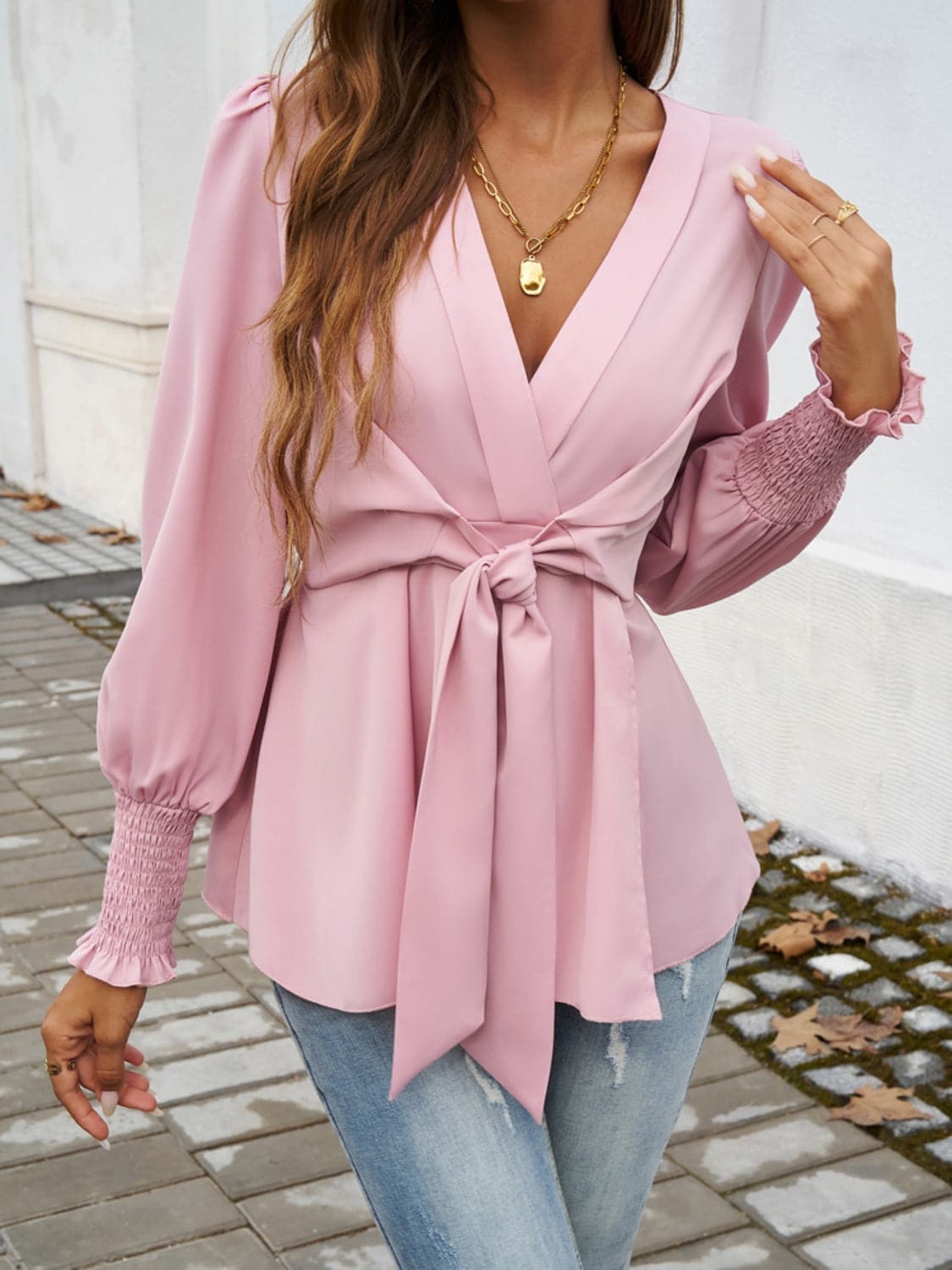 Smocked Surplice Long Sleeve Blouse.