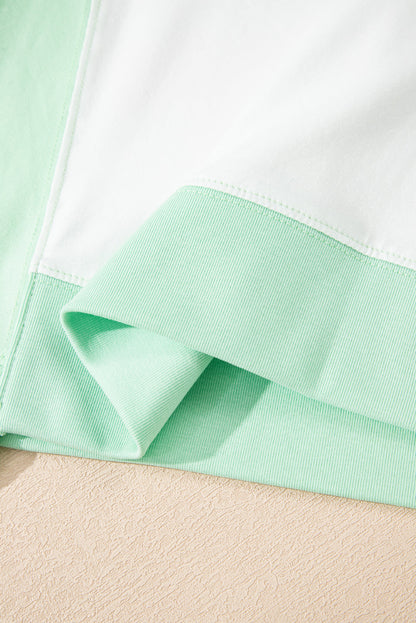 Light green color block exposed seam crew neck t-shirt.
