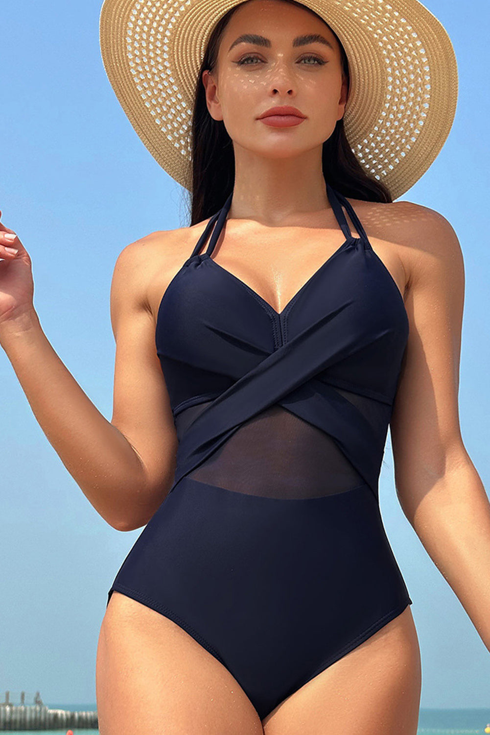 Elegantly chic navy blue halter one-piece swimsuit with mesh accents