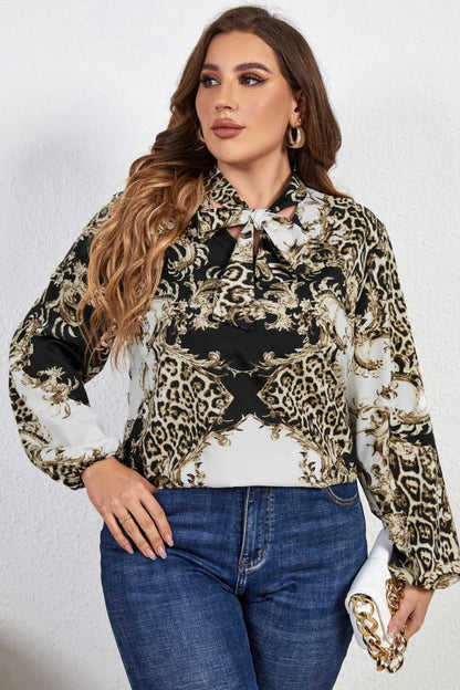 Melo Apparel Plus Size Printed Tie Neck Long Sleeve Blouse.