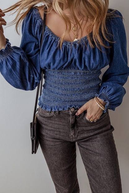 Chic dark blue ruffled puff sleeve denim blouse with smocked details