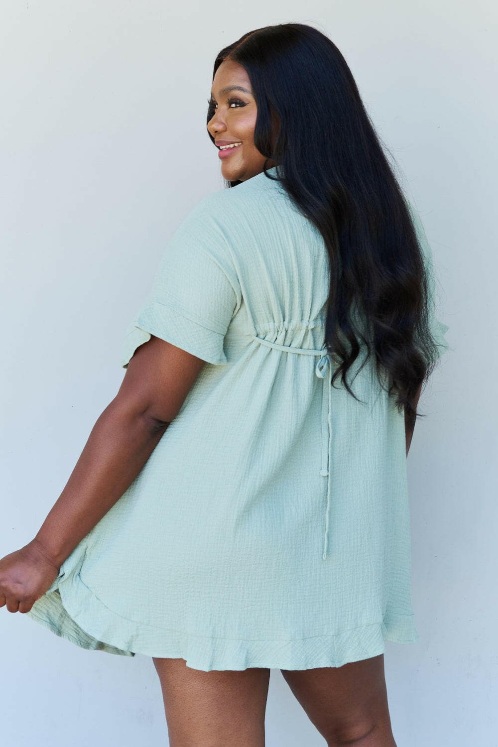 Ninexis Out Of Time Full Size Ruffle Hem Dress with Drawstring WaistbaExperience Effortless Elegance with the Ninexis Out Of Time Full Size Ruffle Hem Dress in Light Sage. This stunning dress is crafted from 100% cotton, providing a soLove Salve Time Full Size Ruffle Hem DressTIKTOK