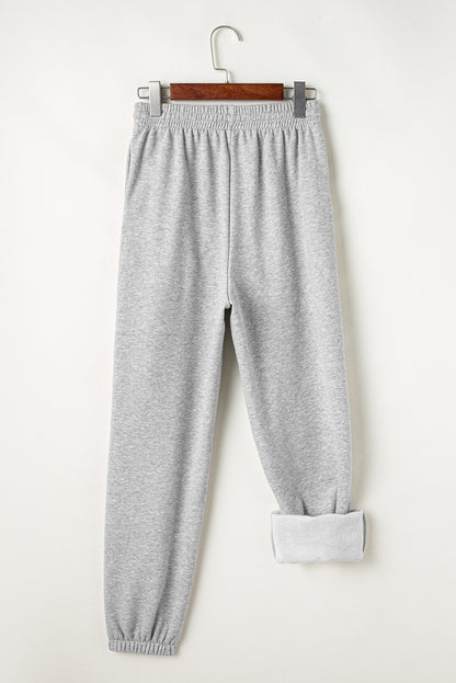 Cozy light grey fleece-lined joggers with adjustable drawstring waist