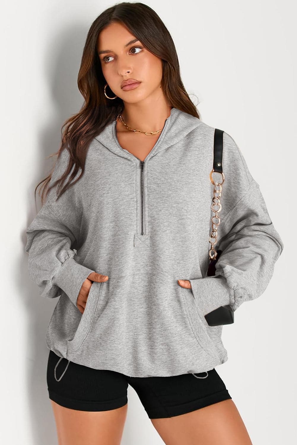 Langärmliger Hoodie mit halblangem Reißverschluss und Taschen