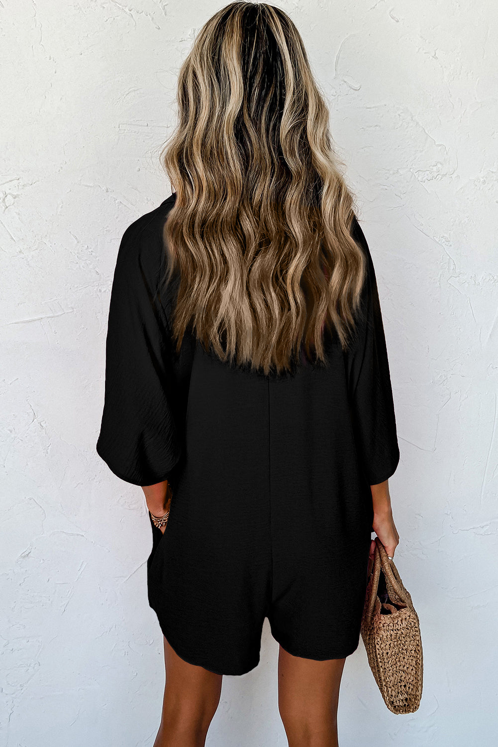 Chic black half-button collared loose romper for everyday style