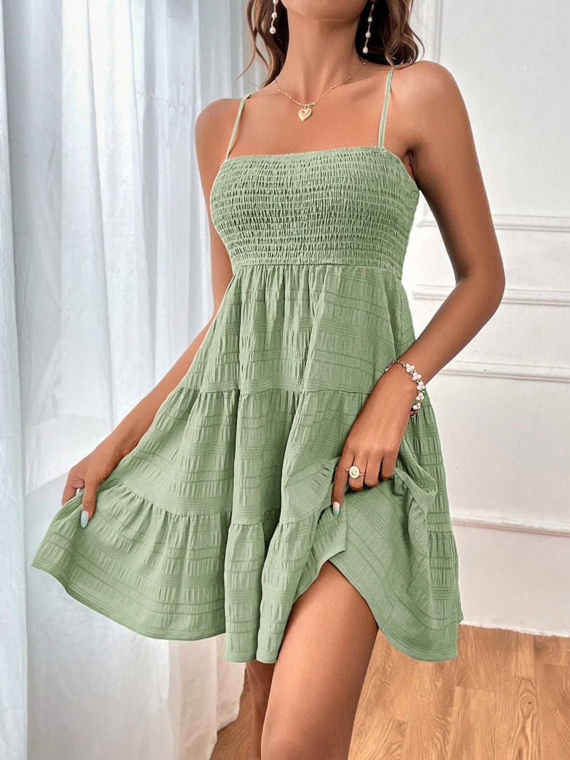 Smocked Tiered Sleeveless Mini Dress.