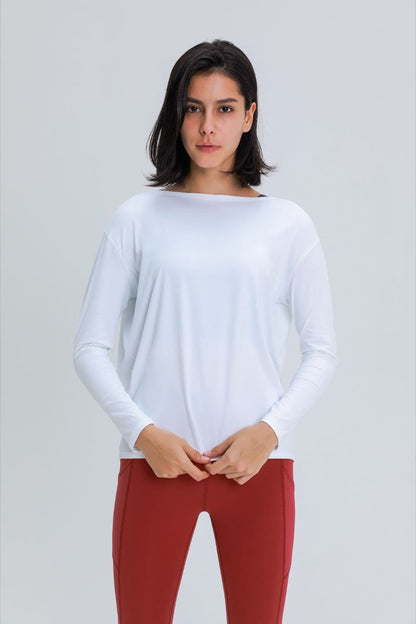 Relaxed fit pullover for post-gym comfort in white, worn by model.