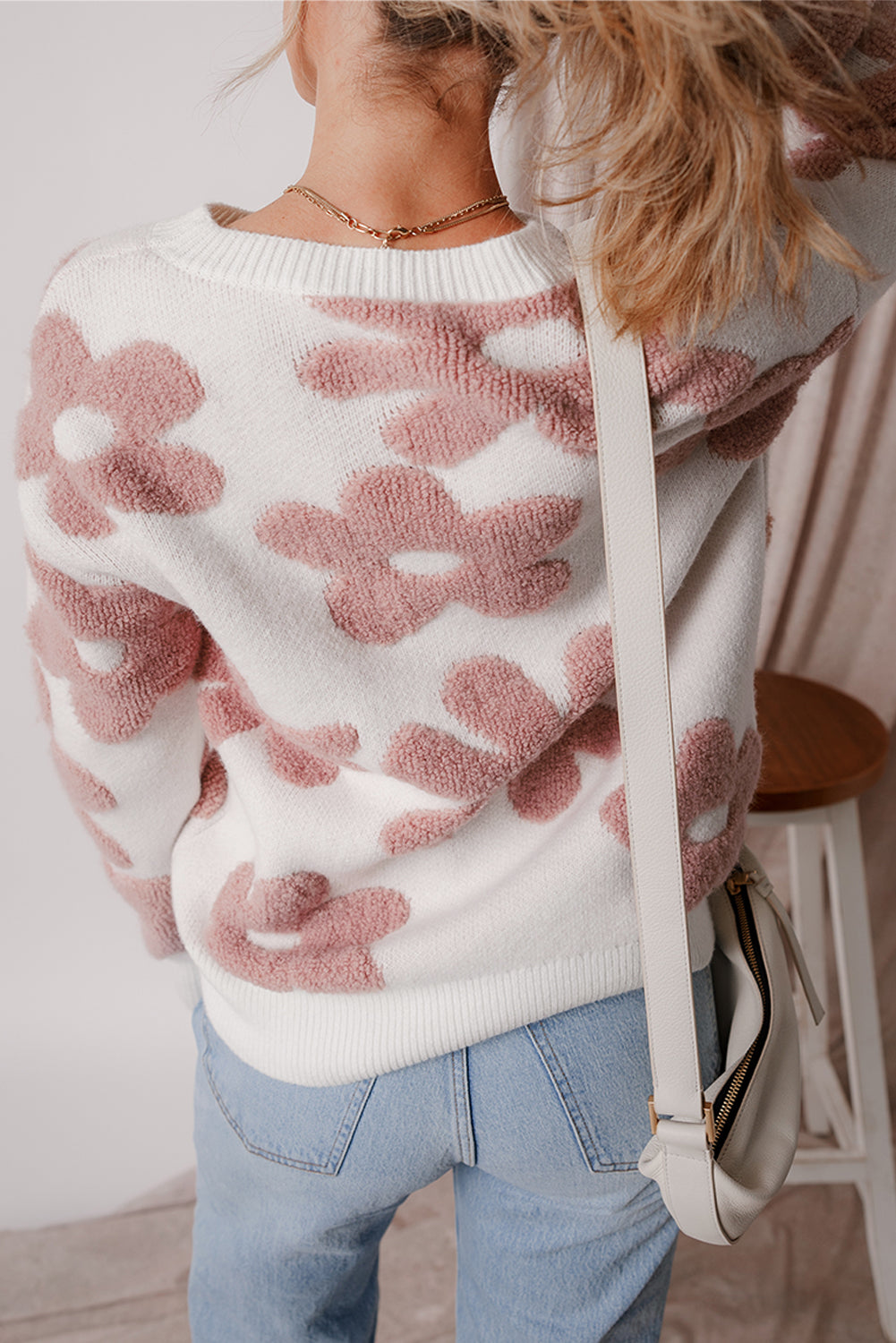 Floral-inspired white drop shoulder sweater for relaxed winter vibes