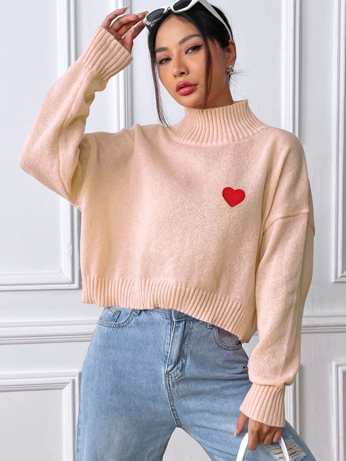 Charming heart turtleneck sweater for cozy elegance