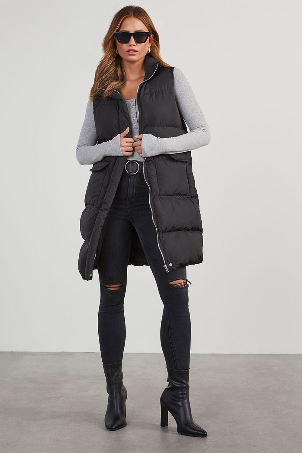 Stylish black longline windproof puffer vest with convenient pockets