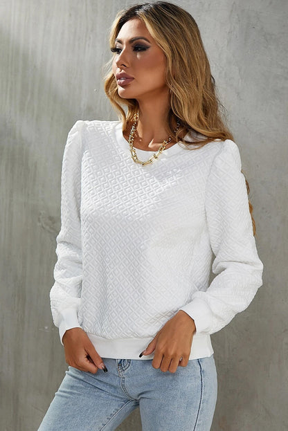 Chic white textured puff sleeve top with round neckline