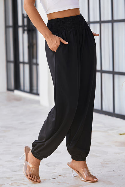 Chic black smocked high-rise joggers for a trendy look