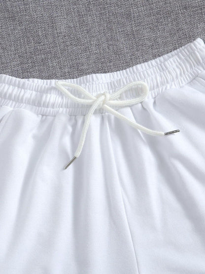 Drawstring Pocketed Elastic Waist Shorts.