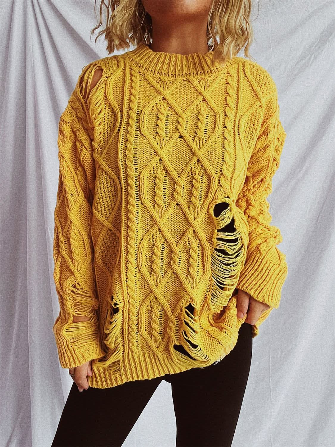 Chic distressed cable-knit sweater