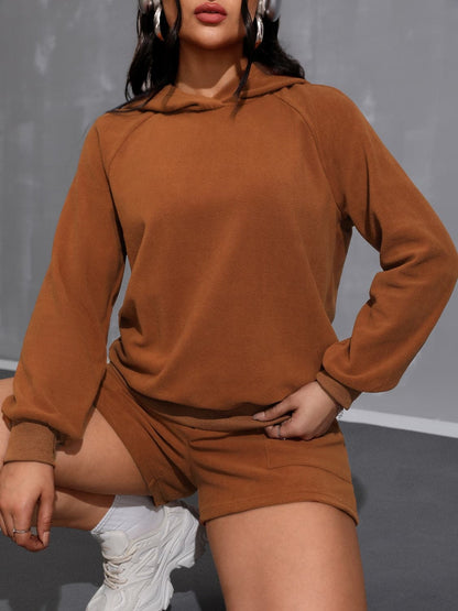 Cozy long sleeve hoodie and shorts ensemble with pockets