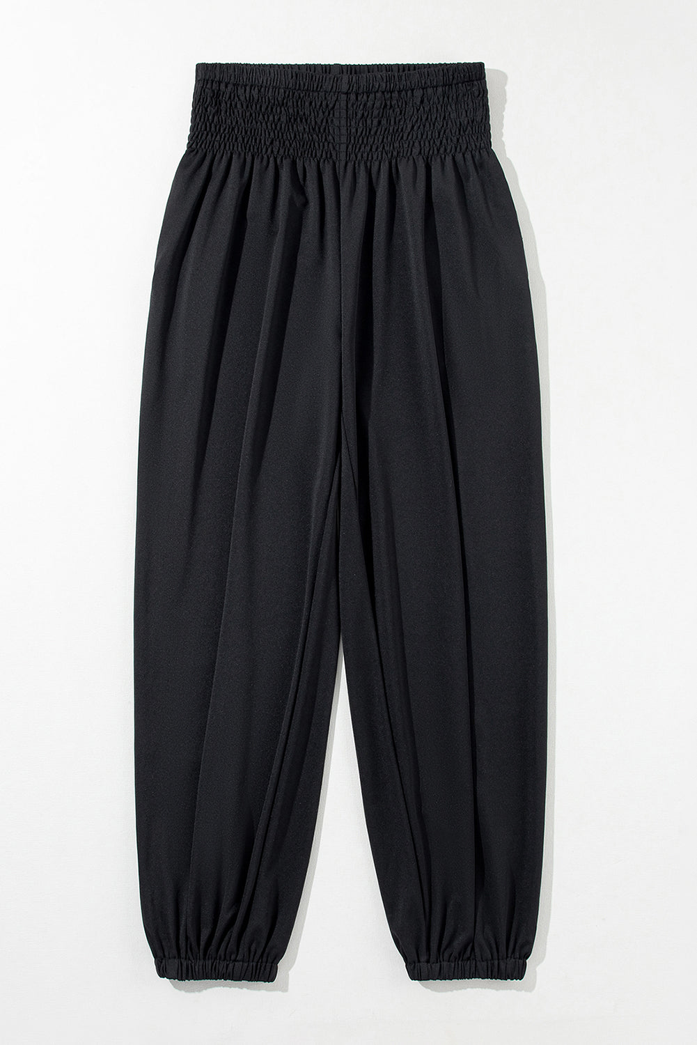 Chic black smocked high-rise joggers for a trendy look