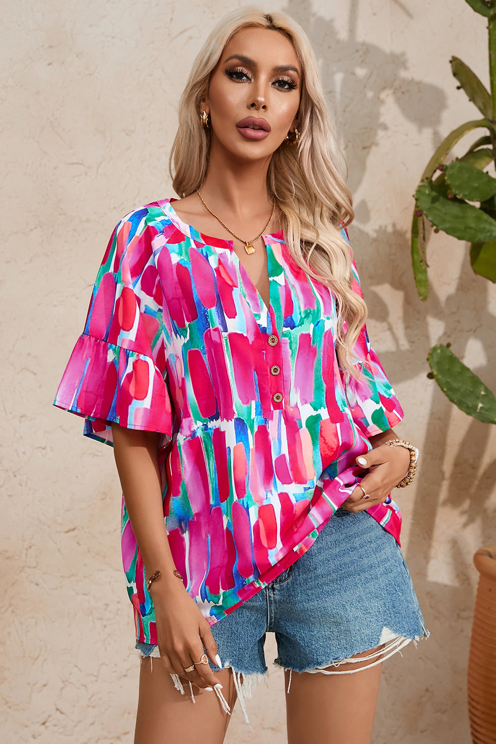 Chic geometric print v-neck blouse with button detail