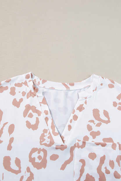 Chic white plus size leopard print v-neck top for effortless style