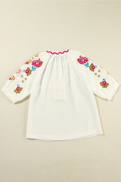 Embroidered Notched Half Sleeve Blouse.