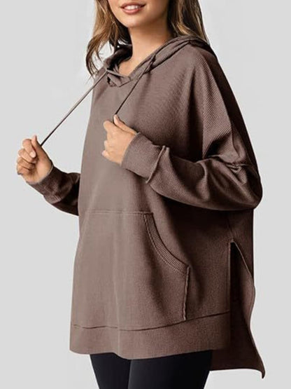 Sleek pocketed hoodie with drawstring and side slit