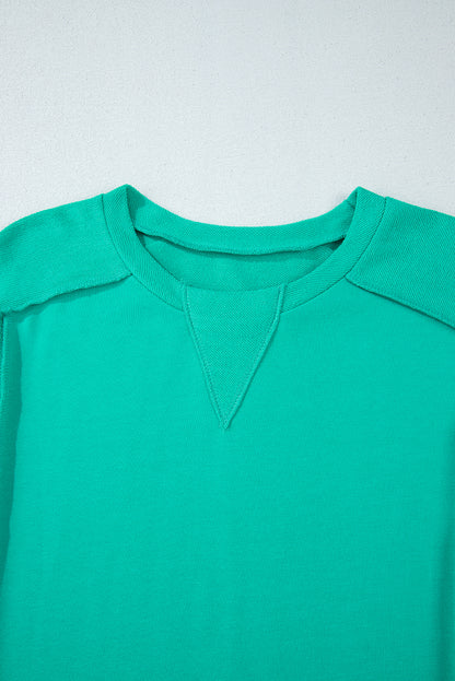 Mint green spliced pullover sweatshirt with round neckline