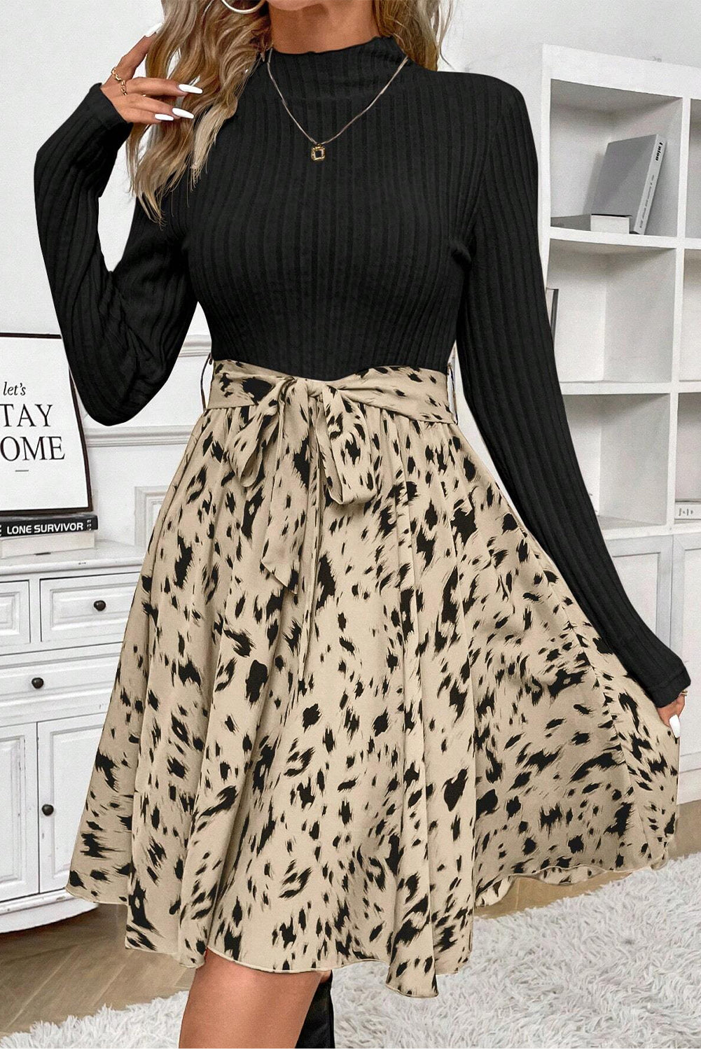 Chic black ribbed knit belted A-line dress with trendy patchwork print