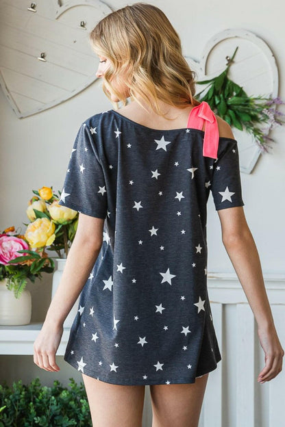 Heimish Full Size Star Print Asymmetrical Neck Short Sleeve Top.