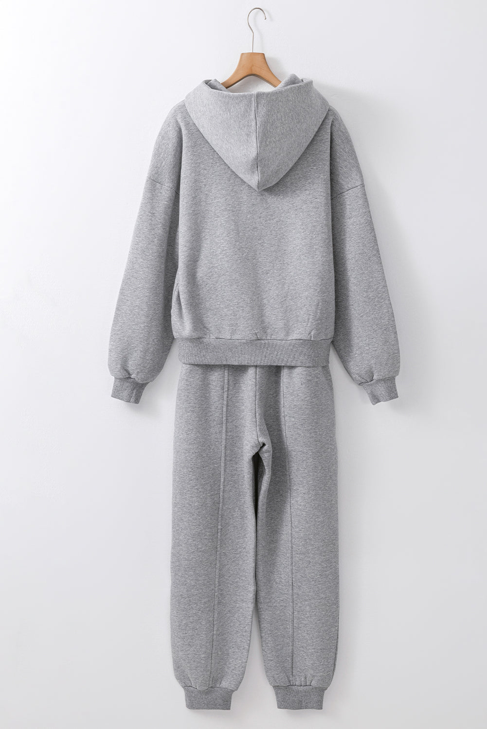 Stylish gray hoodie and joggers set with exposed seams