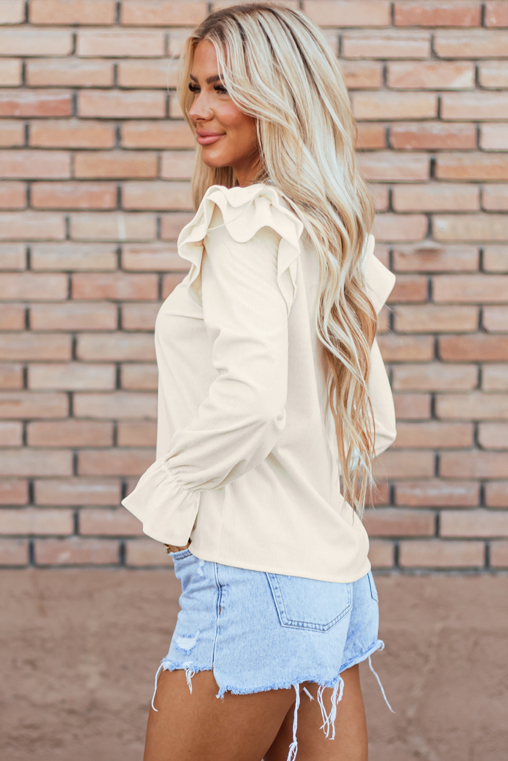 Chic beige corduroy blouse with ruffle sleeves