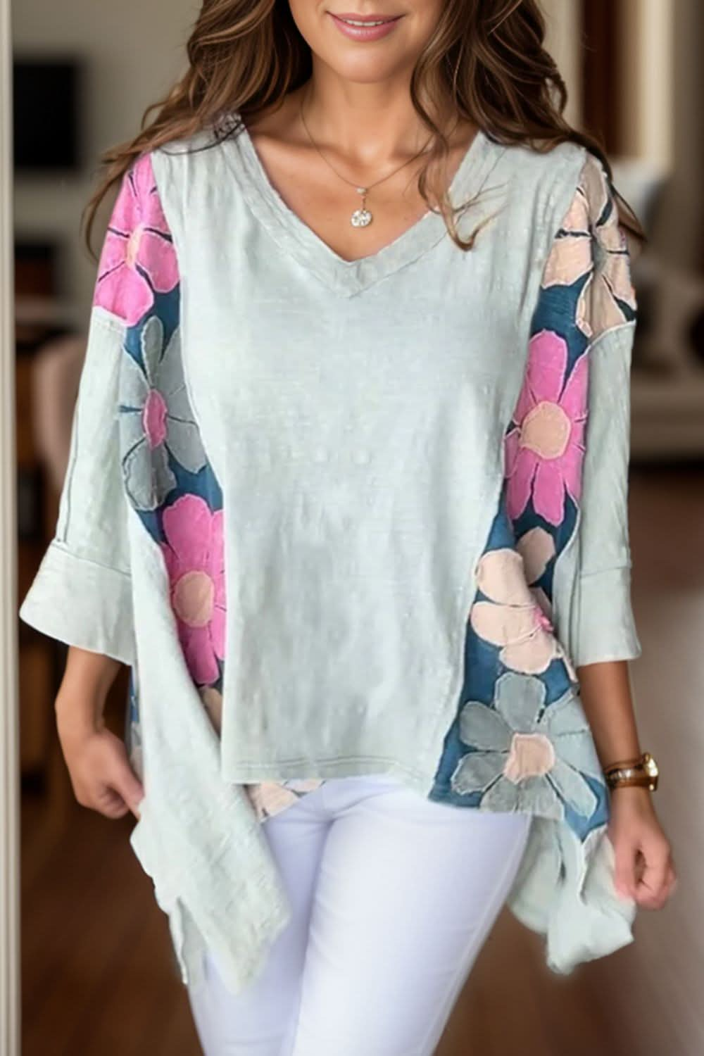 Floral V-neck blouse with three-quarter sleeves and high-low hem