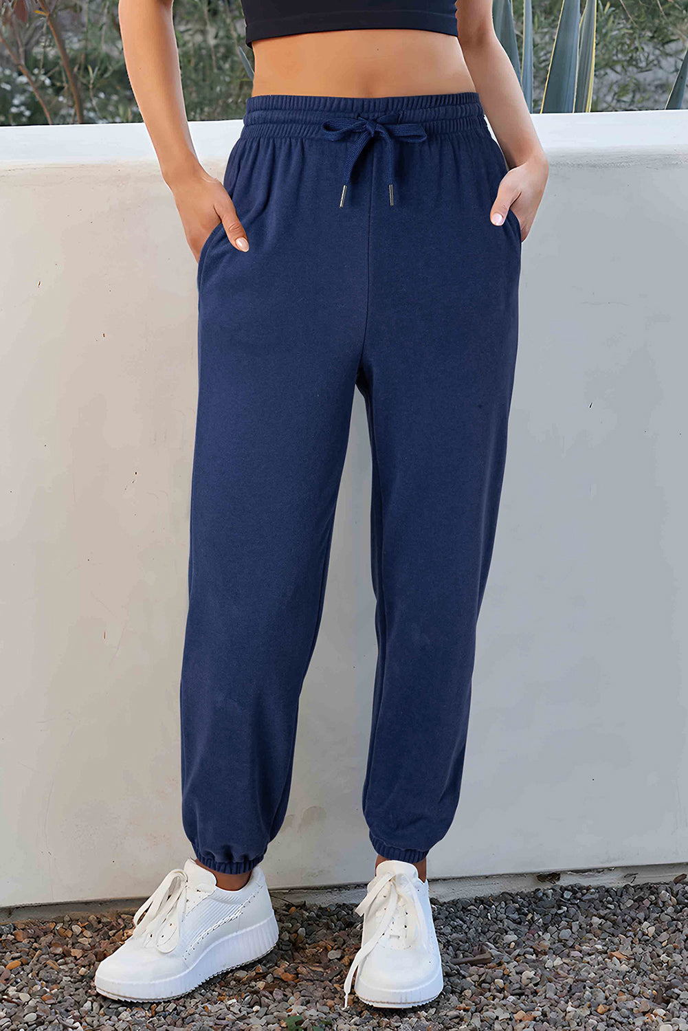 Navy blue fleece-lined joggers with adjustable drawstring waist