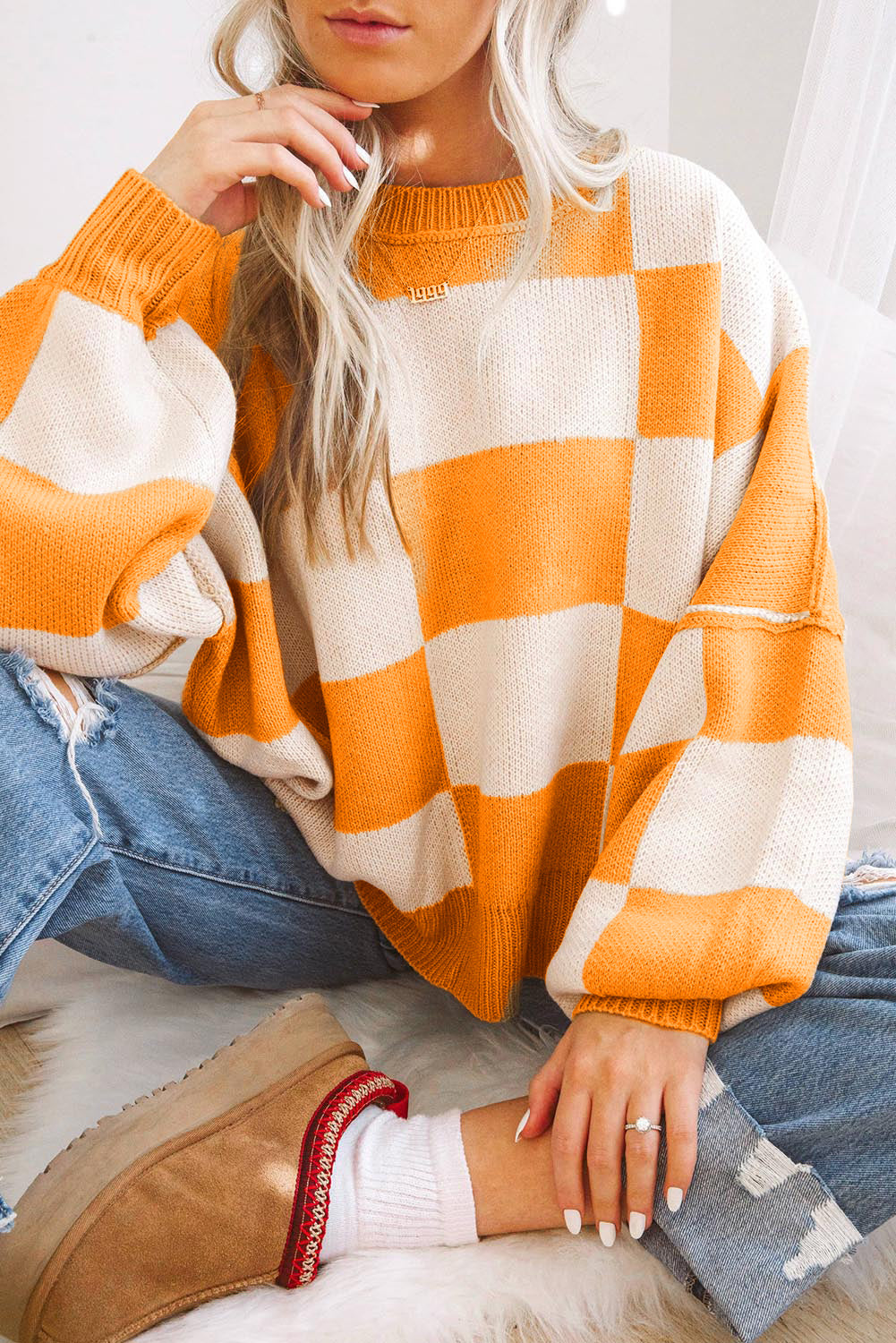 Orange Checkered Bishop Sleeve Sweater with stylish knit design and comfortable fit.