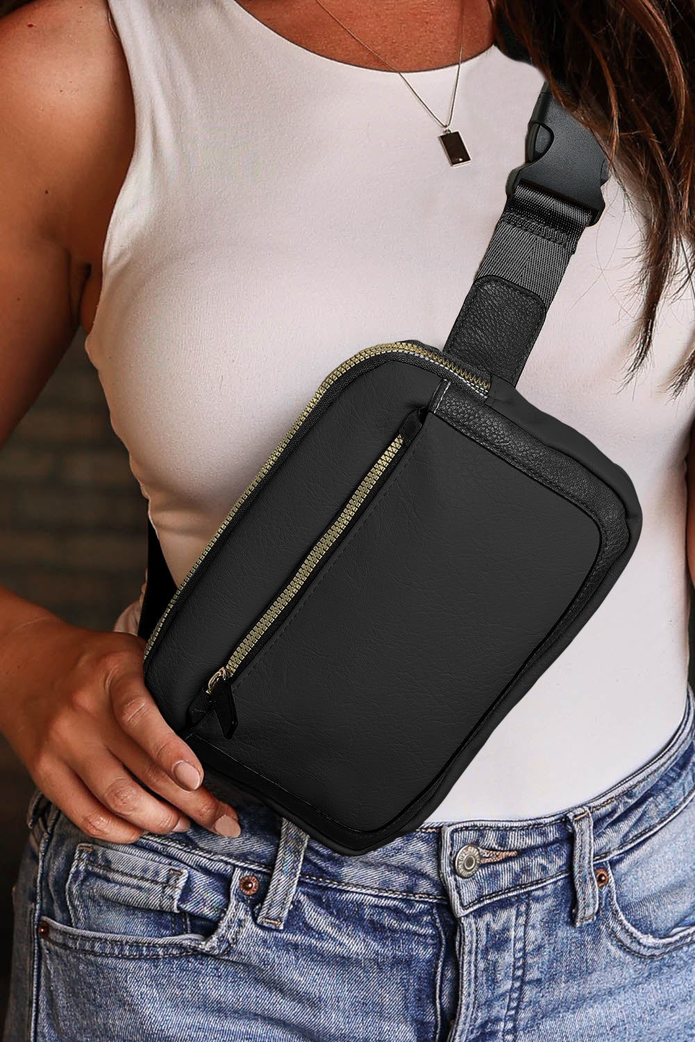 Sleek black crossbody bag with multiple zip compartments