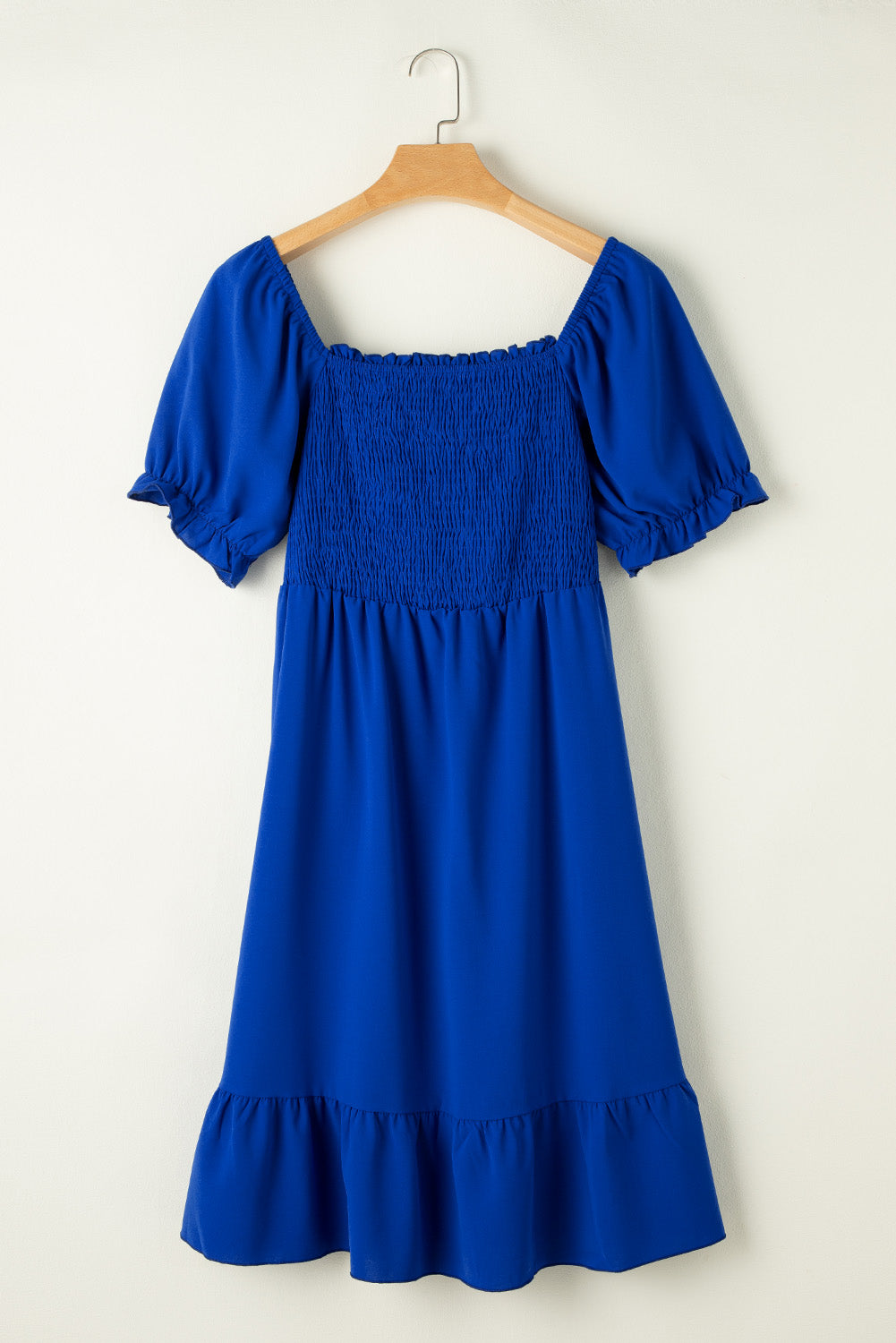 Flattering dark blue ruffled mini dress with square neckline for plus sizes