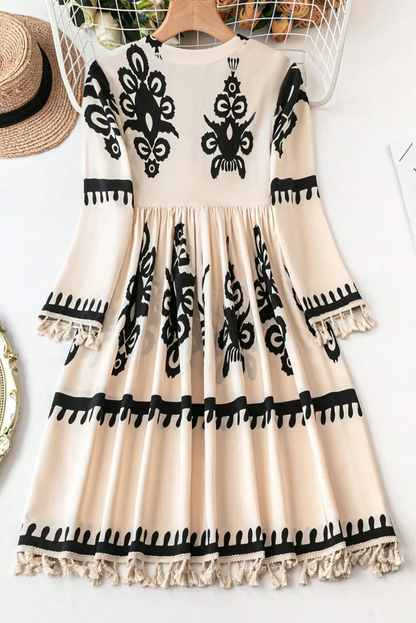 Bohemian tassel mini dress with three-quarter sleeves