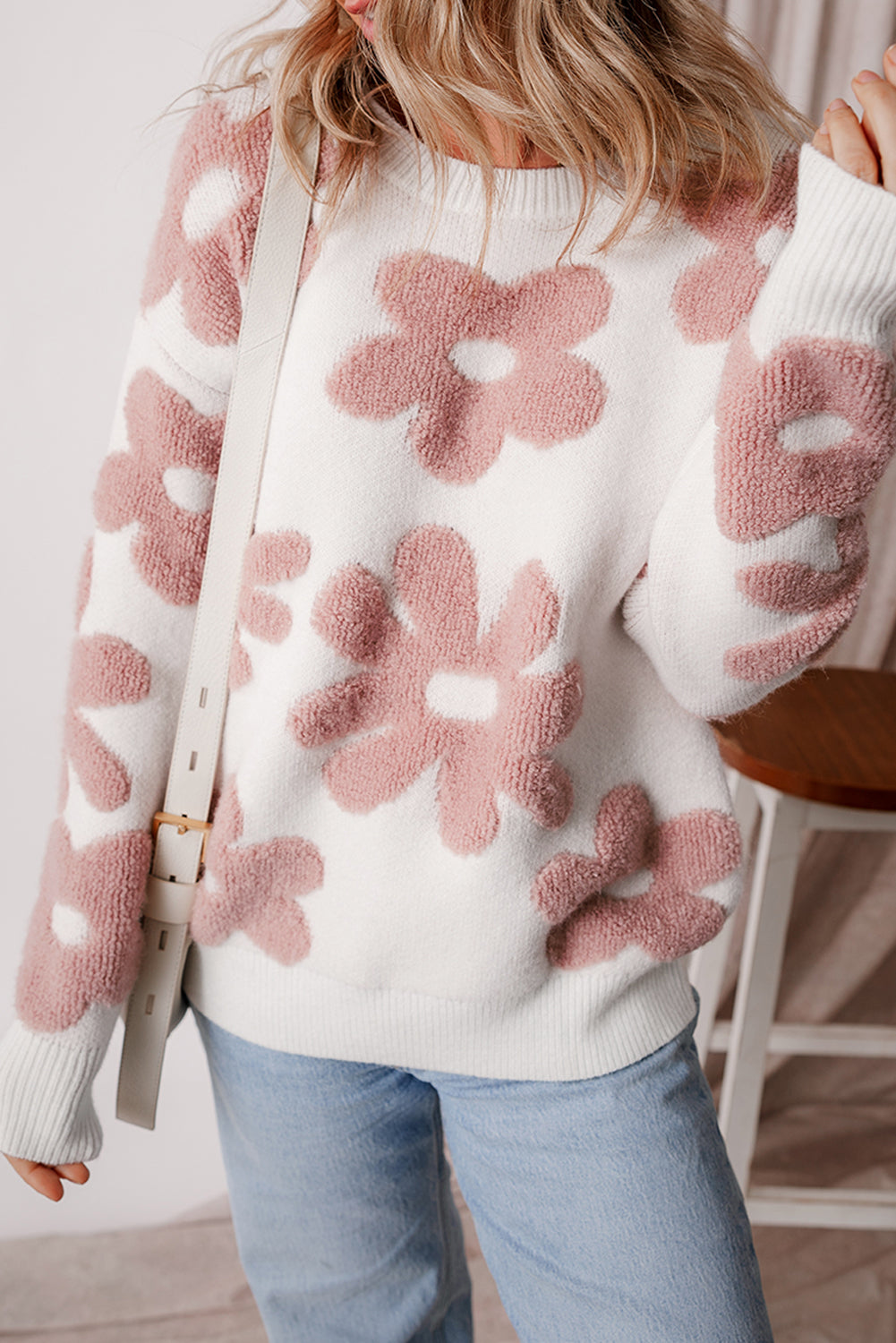 Floral-inspired white drop shoulder sweater for relaxed winter vibes