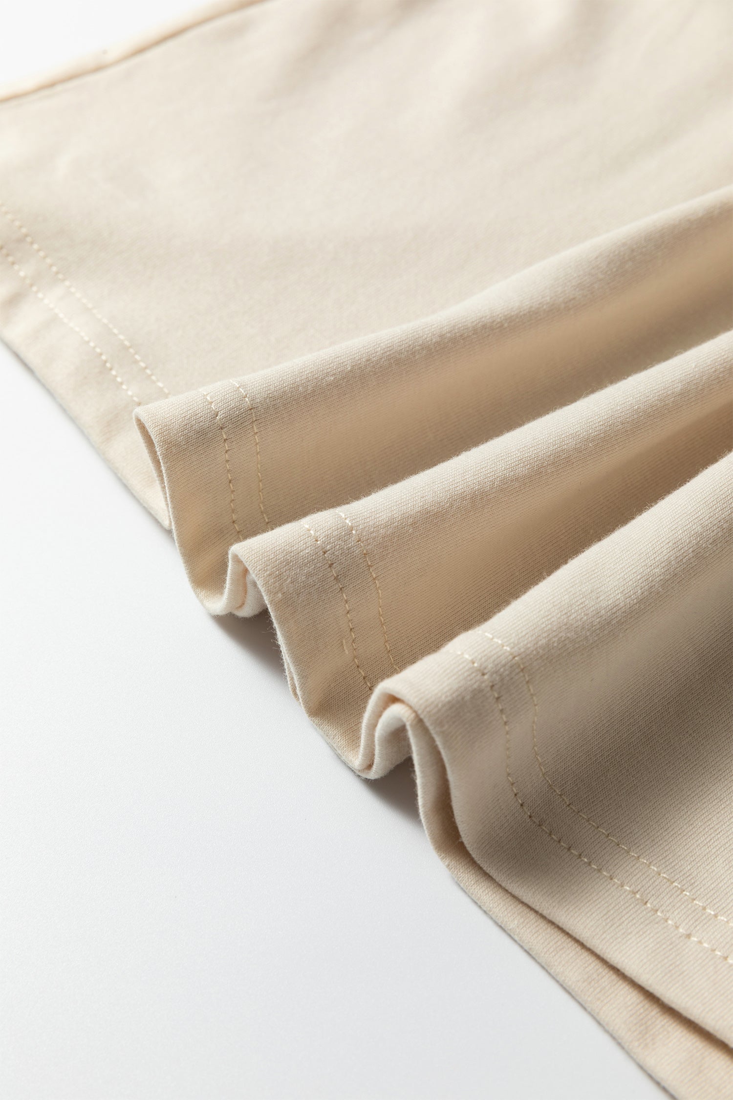 Close-up of the neckline and lace patchwork detail on the Dear-Lover Jet Stream Solid Color Long Sleeve T Shirt, Craft Patchwork.