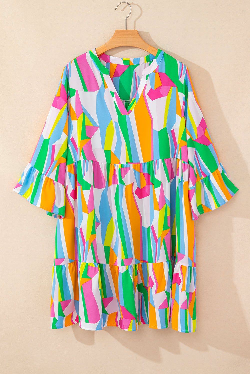 Vibrant multicolour abstract plus size mini dress with tiered ruffles.