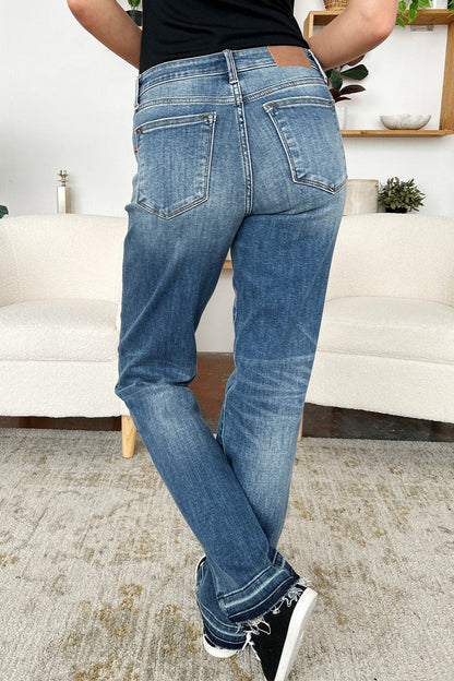 Trendy mid-rise release hem jeans by Judy Blue