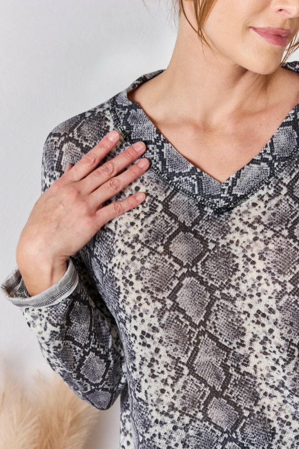 Hailey & Co Full Size Snakeskin V-Neck Long Sleeve TopStep Into the Spotlight with Hailey &amp; Co
 Embrace your boldness and stay on trend with the Hailey &amp; Co Full Size Snakeskin V-Neck Long Sleeve Top. This stunnLove Salve -Neck Long Sleeve Topcloseout