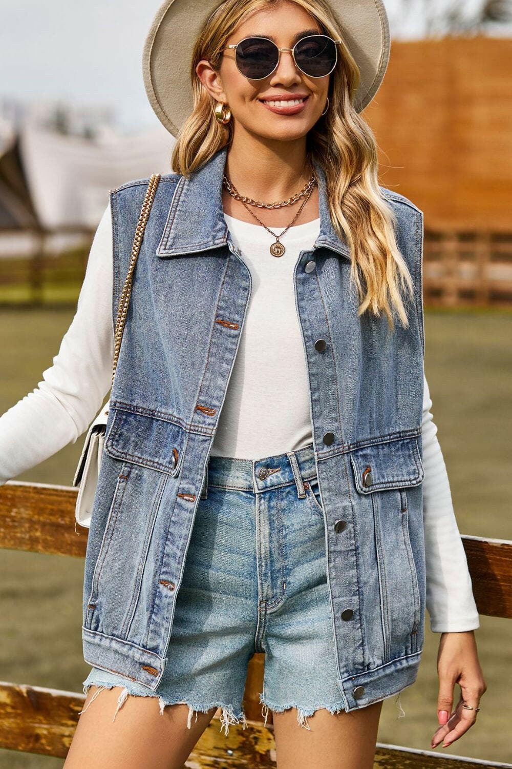 Sleeveless Collared Neck Denim Top with Pockets.