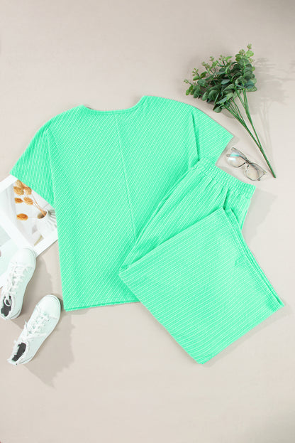 Chic mint green plus size batwing sleeve tee and wide-leg pants ensemble