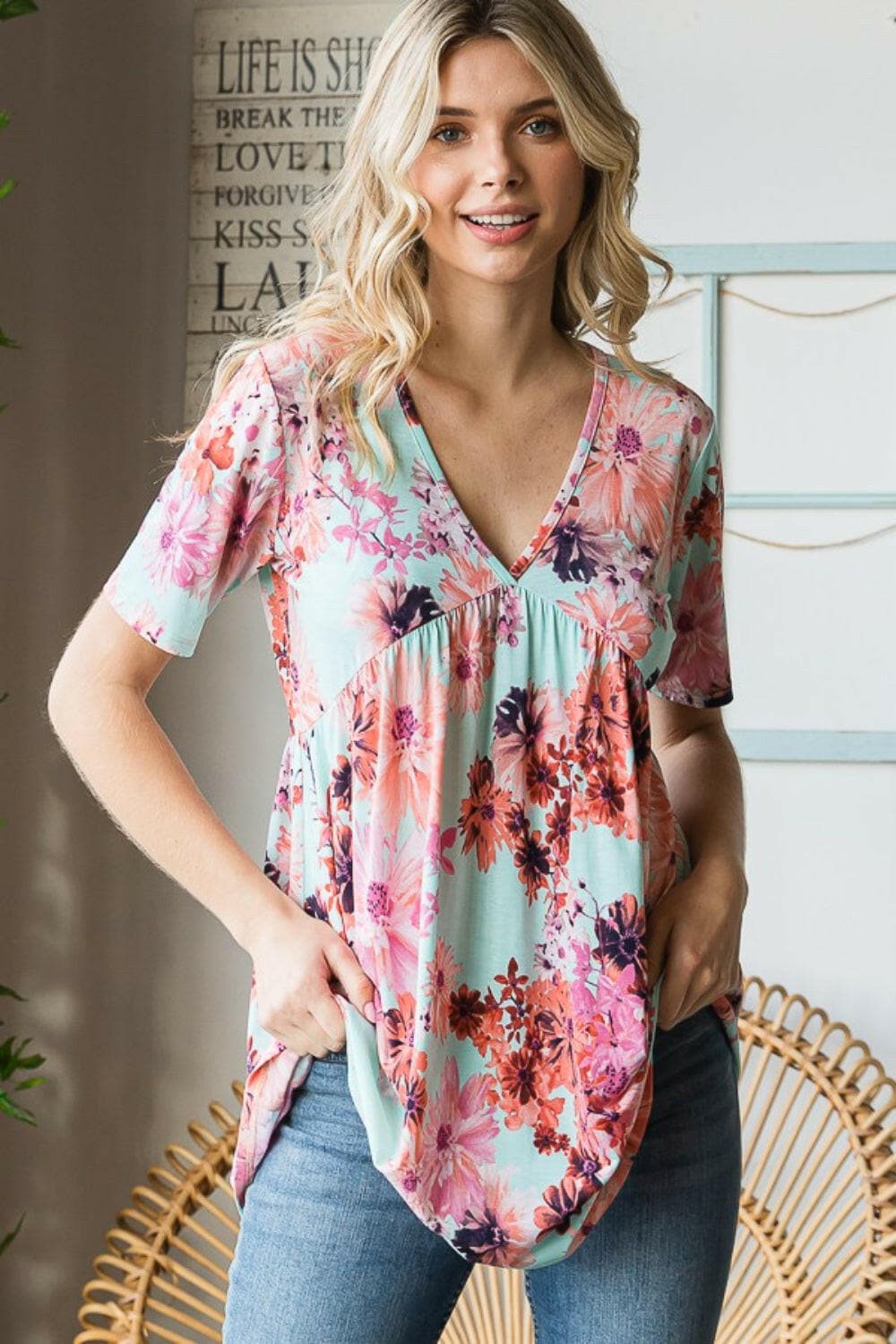 Heimish Full Size Floral V-Neck Short Sleeve Babydoll Blouse.