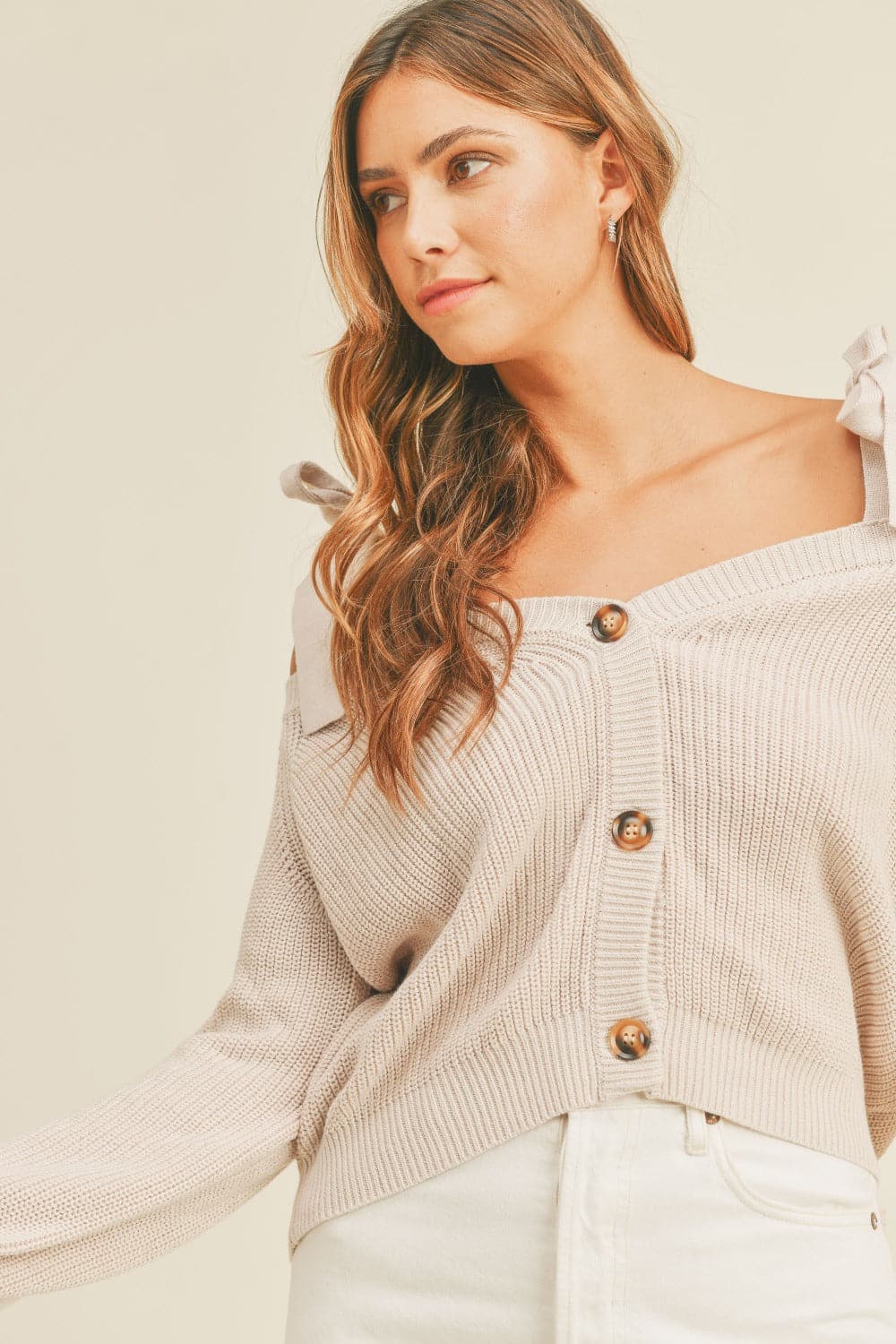 Chic off-shoulder button-down sweater with self-tie straps