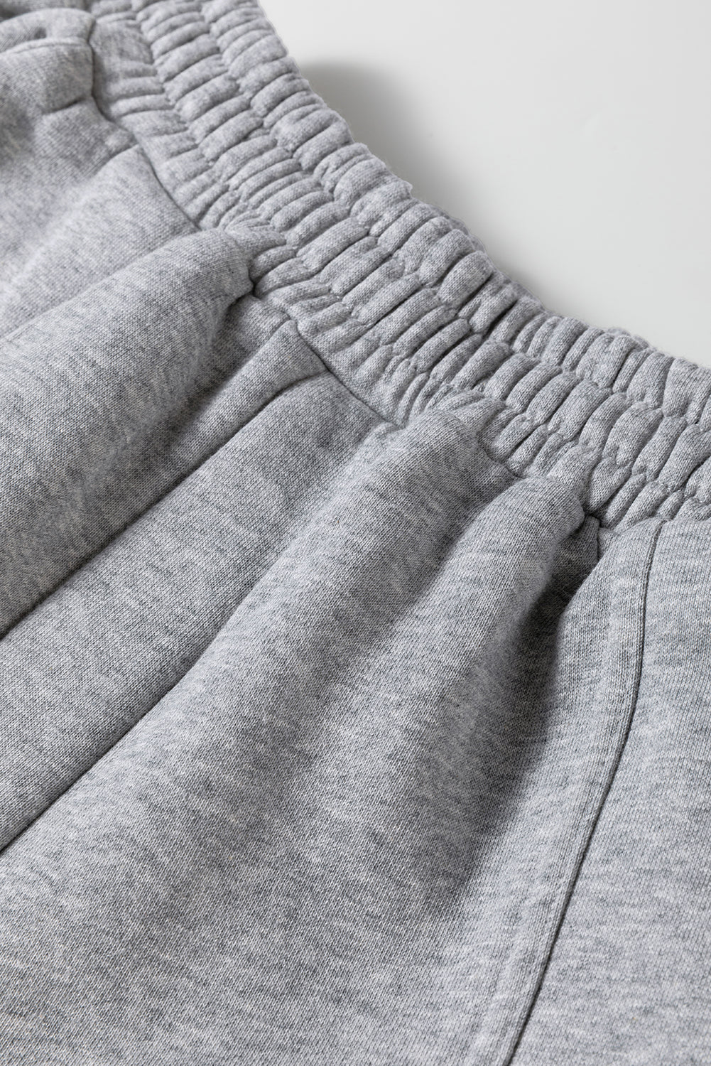 Stylish gray hoodie and joggers set with exposed seams