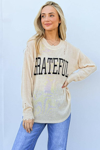 And The Why GRATEFUL Long Sleeve Knit TopStay Chic and Cozy with the GRATEFUL Long Sleeve Knit Top
 The GRATEFUL Long Sleeve Knit Top is your perfect companion for effortless style this season. Crafted fromLove Salve GRATEFUL Long Sleeve Knit Topjust arrived